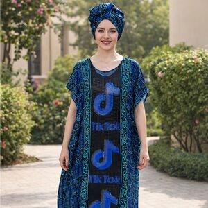 Embellished Afrocentric Goddess dress with tasselled scarf.